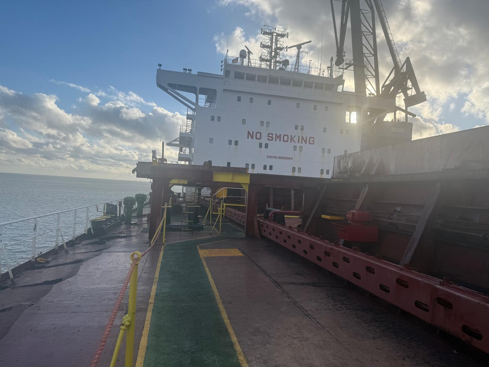Vessel at anchor awaiting survey attendance